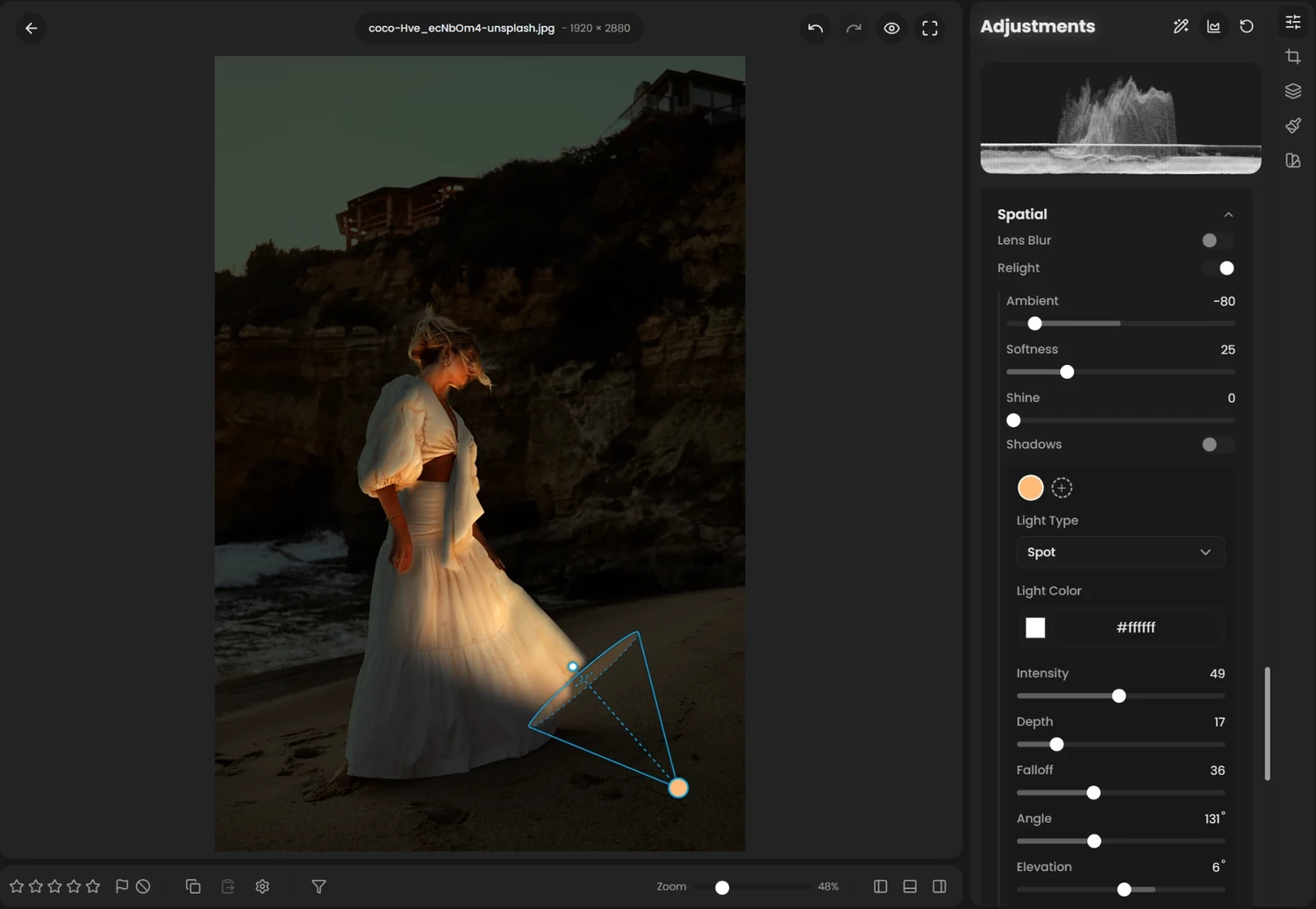 The Relight controls in RapidRAW: a spot light aimed at the dress, with its cone and handles drawn on the photo, Ambient at -80